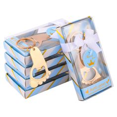 a set of four wooden scissors in a gift box