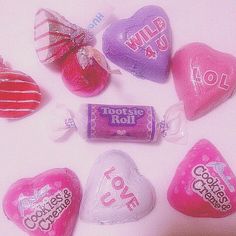 several candy hearts are arranged on a table