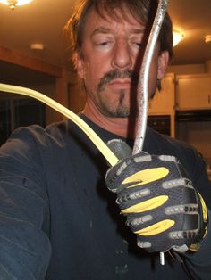 a man holding a pair of scissors in his hands