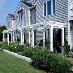 a row of gray houses with white trim