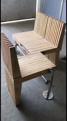 a man is bending over and working on a wooden coffee table with metal bars attached to it