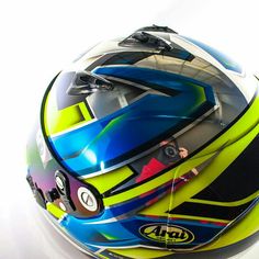 the helmet is designed to look like it has been painted with different colors and shapes