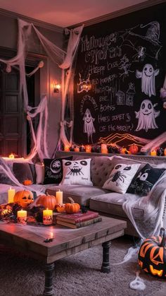 a living room decorated for halloween with candles and decorations