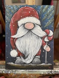 a painting of a santa clause holding a candy cane