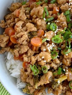 a white bowl filled with rice and vegetables