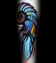 an artistic tattoo design on the leg of a person's arm, with colorful lines and