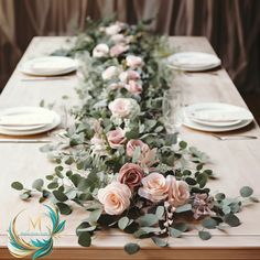 a long table with flowers and greenery on it