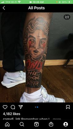 a person with a tattoo on their leg