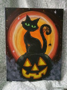 a painting of a black cat sitting on top of a jack - o'- lantern