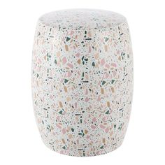 a white stool with pink, green and yellow speckles on the top in front of a white background