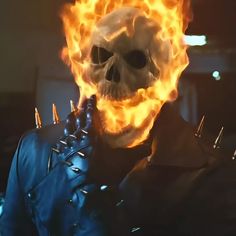 a skeleton with spikes on its head and flames in the air around it's face