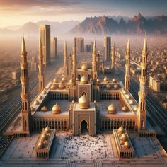 an aerial view of a large building in the middle of a desert area with mountains in the background