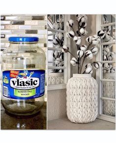 a vase filled with cotton flowers sitting next to a glass jar full of water and cotton stems