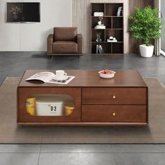 a living room with a couch, chair and coffee table in front of a television