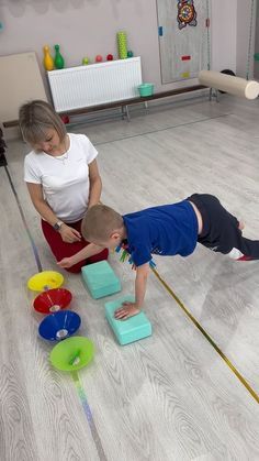 two children playing with blocks on the floor