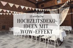 an outdoor event with white tables and chairs in front of a brick wall that reads, hocchezetsdeko - iden mit wow - effet