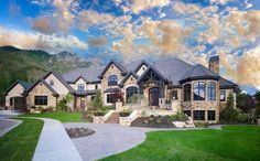 a large house with lots of windows and landscaping