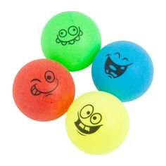 three different colored balls with faces drawn on them