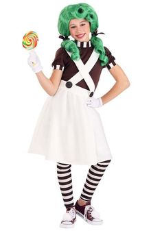 a woman in a costume holding a lollipop