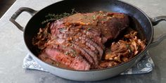 a pot with some meat in it on a table