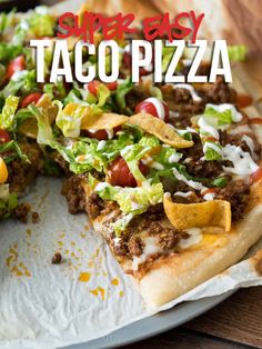 the taco pizza is cut in half and ready to be eaten