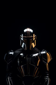 a star wars character in black and gold armor with his hands on his hips, facing the camera