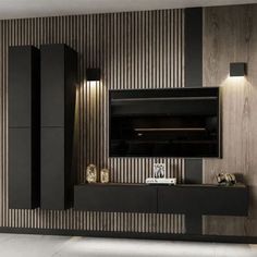 a modern living room with black and white walls, wood paneling and an entertainment center