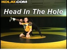 two people on a wrestling ring with the words head in the hole above them and below