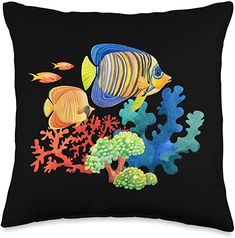 a black pillow with colorful fish and corals on it