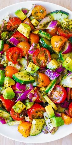 a white plate topped with lots of veggies