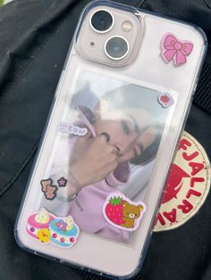 an iphone case with stickers attached to it