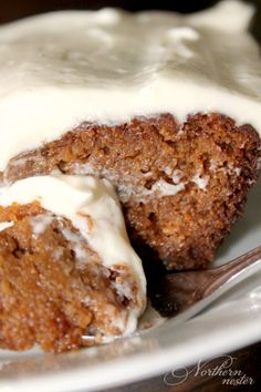 a close up of a piece of cake on a plate with a fork in it