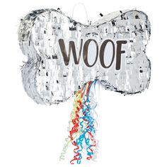 a dog bone shaped balloon with the word woof on it