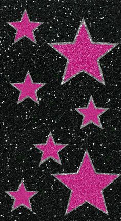 pink glitter stars on black background