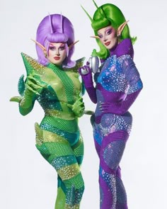 two women dressed in costume standing next to each other