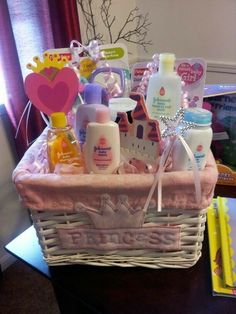 a basket filled with baby items sitting on top of a table