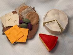 there are several pieces of felt on top of each other, including a piece of cheese