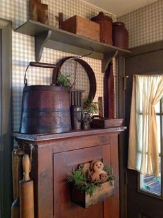 an old fashioned kitchen with pots and pans