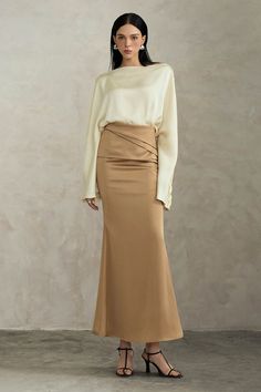 Indulge in luxury with our skirt. The trumpet high waist design accentuates your curves while the ankle length silhouette adds an air of sophistication. Made with premium silk, this skirt will elevate any outfit and make you feel like a work of art. Elegant Formal Maxi Skirt, Elegant Flowy Maxi Skirt In Solid Color, Elegant Solid Color Flowy Maxi Skirt, Beige Silk Skirt For Formal Occasions, Elegant Fitted Lined Maxi Skirt, Elegant Long Pleated Skirt, Elegant Fitted Maxi Skirt With Lining, Elegant Fitted Maxi Skirt With Lined Skirt, Formal Beige Silk Skirt