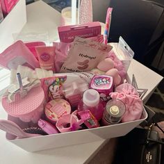 a white box filled with lots of pink items