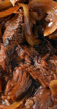 beef and onions are cooked together in the slow cooker, ready to be eaten