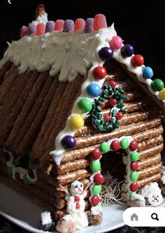 a gingerbread house is decorated with candy and candies