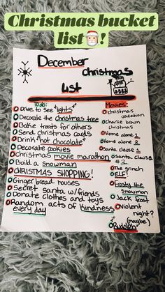 a christmas bucket list on top of a pile of gray fluffy carpet with green lettering