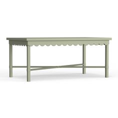 a green table with a scalloped top on the bottom and an open shelf below it