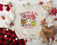 Whoville & Co. Sweatshirt,Grinch Cindy Lou and Max Christmas Sweater,Grinchmas Shirt,Whoville University Tee,Funny Christmas Gift,Merry Xmas 🐌How to place an order 1.) Please look at every photo 2) Select the color of your sweatshirt. 3. Choose "Add to Cart." You can return to add more merchandise. 4. Select "Check out now." 5. You can include a note to the seller with any requests when you check out. 🐌 Product Details Unisex & Classic fit 8 oz./yd² (US) 13.3 oz./L yd (CA), 50/50 cotton/polyes Cindy Lou Who Shirts, Cindy Lou Who Shirt, Grinch Crewneck Sweatshirt, Grinch Crewneck, Whoville University Sweatshirt, Xmas Grinch, Grinch Cindy Lou, Christmas Crewneck Sweatshirt Grinch, Whoville University