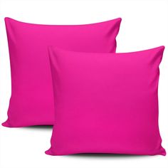 two bright pink pillows sitting next to each other