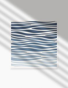 an abstract blue and white painting with wavy lines in the middle, on a gray background