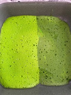 two different colors of green liquid in a pan