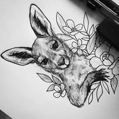 a pencil drawing of a kangaroo with flowers on it's head and leaves around its neck