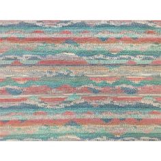 an area rug with multicolored waves on it